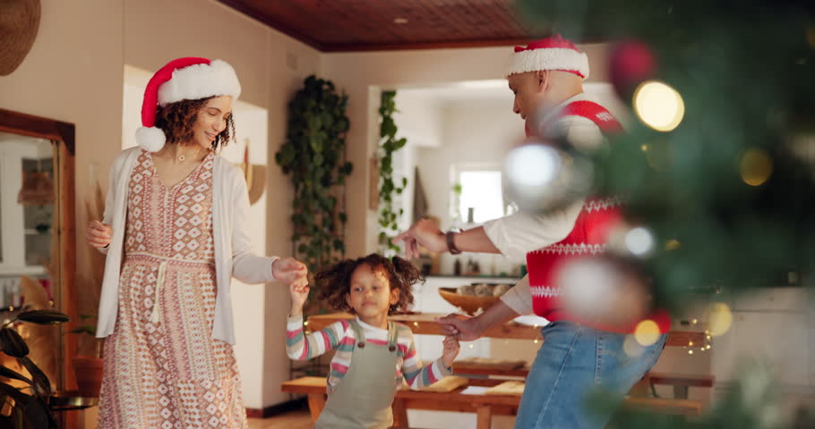 Parents, girl and excited with dancing on Christmas at home for fun, break and celebration. People, family and happy with kid jumping in living room on festive season for unity, love and support