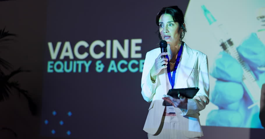 Woman, speaker and talk at seminar, stage and info for inclusion, equality and accessibility to vaccine. Person, mic and presentation with tablet for pharmaceutical company at global conference