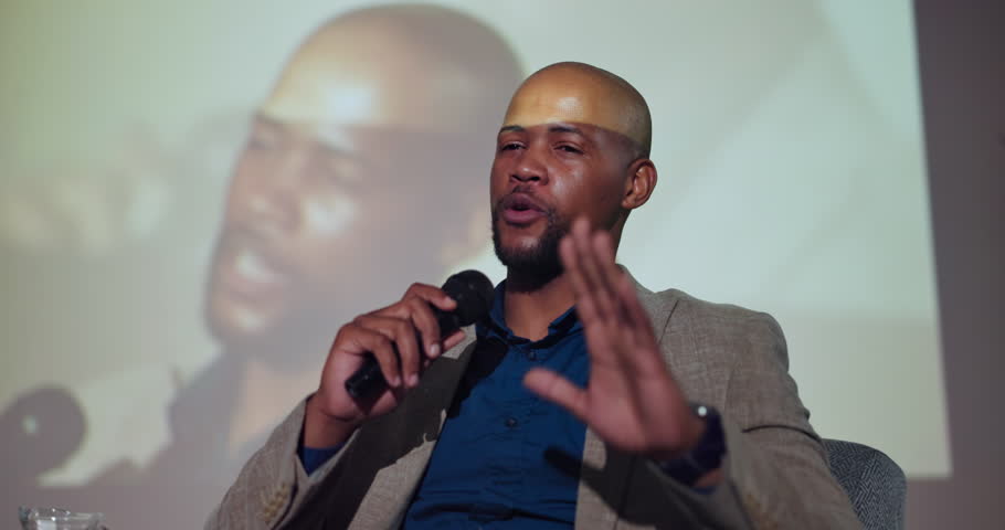 Business man, speaker and mic at convention, stage and discussion at event for global economy. Person, analyst and happy with speech, info and feedback at international conference for presentation