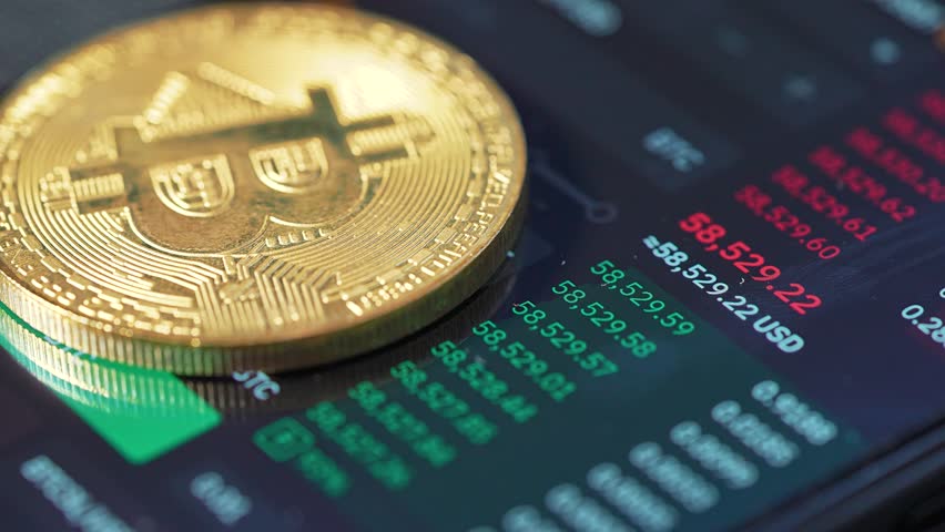 Bitcoin coin on stock chart. Bitcoin coin represents finance and electronic currency. Concept of Bitcoin coin as digital asset. Bitcoin coin trading and investment. Finance of electronic currency.