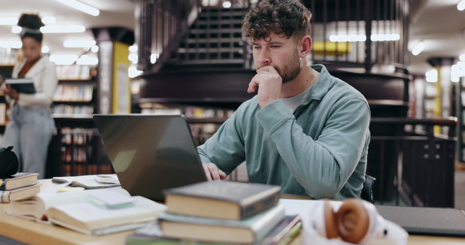 Student, thinking and man in library, laptop and typing with education, university and knowledge. College, person and guy with computer, studying and research for project, network and problem solving