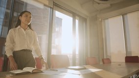 Asian businesswoman shakes hand with man partner in office lit by back sunset. Businesspeople follow etiquette greeting before negotiation in meeting room - Powered by Shutterstock - Get 15% off with code: PIKWIZARD15