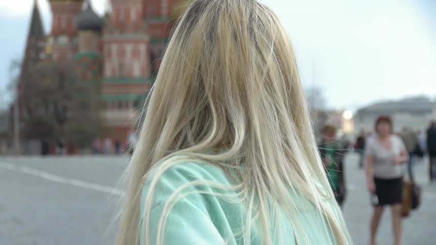 HD1080p25 Sexy woman posing and smiling outside kremlin in russia