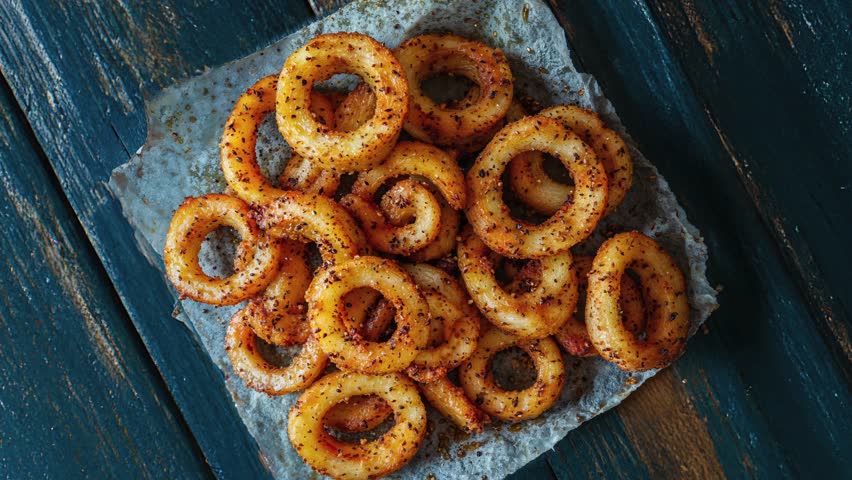 Delicious Crispy Onion Rings on Rustic Paper Background