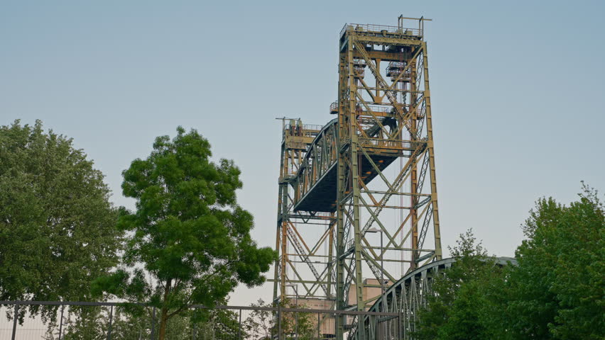The lift bridge De Hef or Koningshavenbrug.City traffic crossing Koninginnebrug
