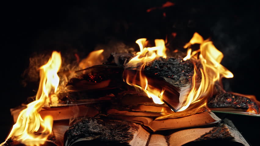 Old Open Books Burning. Big Bright Flame On Papers. Destruction Of Diary. Concept of censorship, prohibition of freedom information, 451 fahrenheit, old literature paper format is no longer in demand