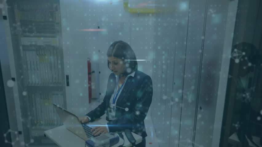 Animation of virus warning text and data processing over biracial businesswoman by servers. Global finance, business, connections, computing and data processing concept digitally generated video. - Powered by Shutterstock - Get 15% off with code: PIKWIZARD15