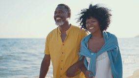 Cinematic video of an happy latin senior couple spending time at the beach. Concept  about seniority and lifestyle - Powered by Shutterstock - Get 15% off with code: PIKWIZARD15