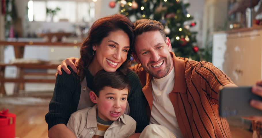 Christmas, happy and selfie of parents with child in home excited for holiday, vacation and festive celebration. Family, smile and mom, dad and kid take photo for social media, memory and bonding