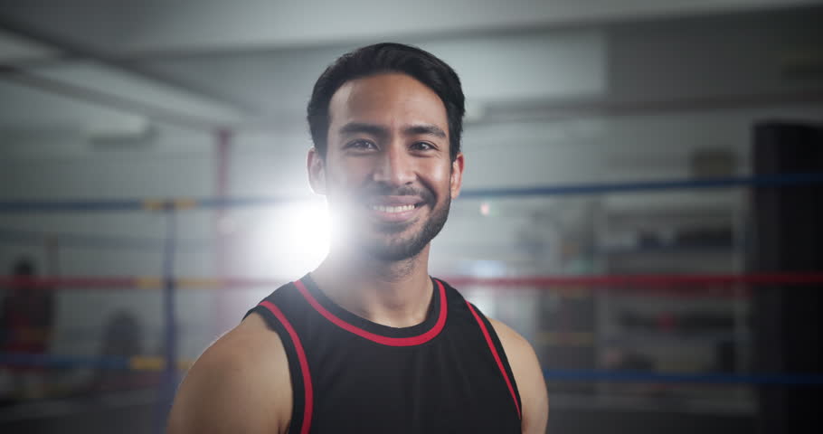 Happy, sports and face of man boxer in gym for competition practice, match or workout for conditioning. Smile, confident and portrait of fighting champion from Mexico in ring for fitness training.