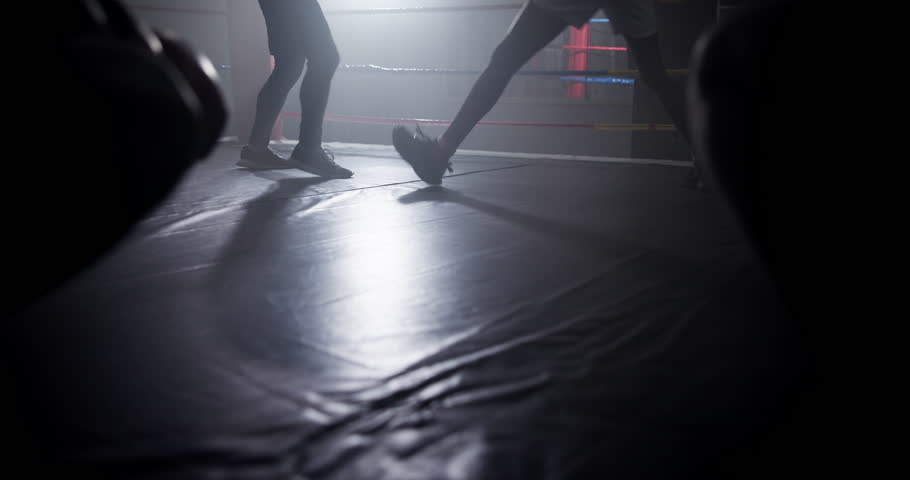Boxer, coach and men with workout for competition in boxing ring with punch training, agile fighting skills and intense action. Impact sport, fitness and personal trainer with gloves for self defense