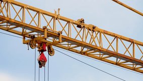 Close up view of Tower crane at construction site. Heavy machinery and construction. Transportation, warehouse. High rise crane with jib - Powered by Shutterstock - Get 15% off with code: PIKWIZARD15