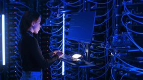 Woman programming in a server room - Powered by Shutterstock - Get 15% off with code: PIKWIZARD15
