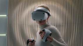 Futuristic neon studio woman explore AR gadget high-tech wear VR glasses goggles gaming simulation helmet female girl play virtual augmented reality cyber video game boxing with controllers metaverse - Powered by Shutterstock - Get 15% off with code: PIKWIZARD15