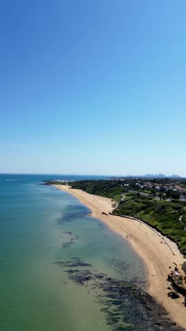 Aerial drone footage showcasing the stunning Melbourne skyline and beautiful beaches. This vibrant view highlights sparkling waters and the iconic cityscape, perfect for sharing the charm of Melbourne