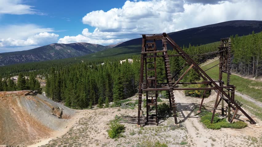 Abandoned mine ruins near Leadville, Colorado. Shot is a flyby shot of a well preserved head frame.