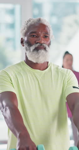 Gym, senior man and fitness with dumbbell for wellness, coordination and balance with endurance. Class, group and male person with weightlifting for muscle strength, aerobics and physical training
