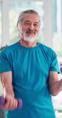 Gym, senior man and exercise with dumbbell for wellness, coordination and balance with endurance. Class, fitness and male person with weightlifting for muscle strength, aerobics and physical training