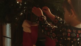 Christmas preparation. Little child decorates home interior for Christmas. - Powered by Shutterstock - Get 15% off with code: PIKWIZARD15