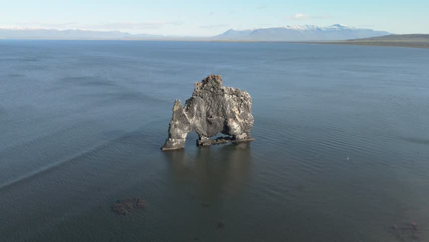 A Stunning Aerial View Of Hvitserkur, The Majestic Three-Legged Rock Formation In Northern Iceland, Resembling A Mythical Creature Rising From The Sea.