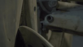 Heavy changer equipment slowly taking off the tire from the vehicle rim. Heavy tire changer machinery used at the industrial factory. Heavy tire changer equipment removing the rubber. Workshop. - Powered by Shutterstock - Get 15% off with code: PIKWIZARD15