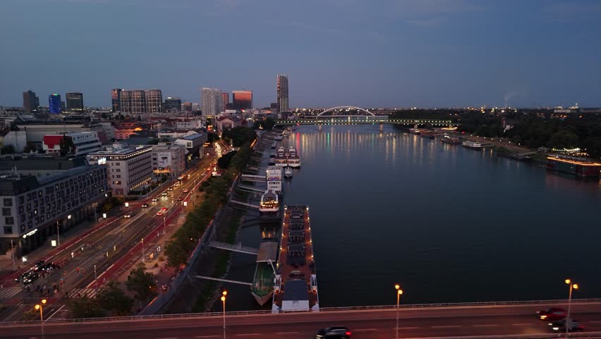 Drone video of SNP Bridge, Bratislava, Slovakia, river Danube at a dusk