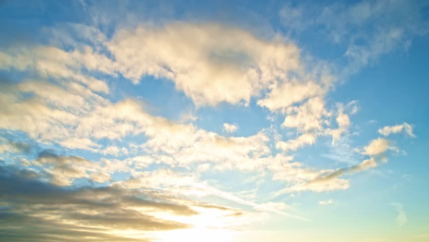 Time lapse Sunset with sun and clouds on blue and orange dramatic sky with sun rays. Night Sky timelapse. Moving clouds at sunset. Evening Clouds. Dusk twilight sky time lapse. Dramatic skies.