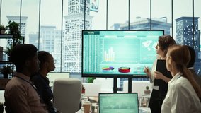 Corporate associates looking into project details and timetables in conference room, establishing budget and operations to accomplish objectives in a competitive business environment. Camera B. - Powered by Shutterstock - Get 15% off with code: PIKWIZARD15