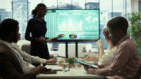 Diverse work team collaborating on project management tasks, utilizing smart technology and detailed analytics to optimize resource allocation and ensure enterprise objectives. Camera B. - Powered by Shutterstock - Get 15% off with code: PIKWIZARD15