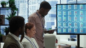Businessman announces company bankruptcy during a meeting, explains collapse and job losses to worried employees as financial data on the screen reflects economic failure and insolvency. Camera A. - Powered by Shutterstock - Get 15% off with code: PIKWIZARD15