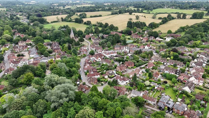 Shere Surrey UK quaint English Village high angle establishing aerial shot
