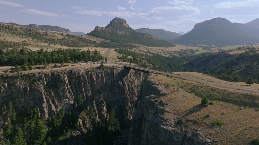 Drone orbit of Sunlight Creek Bridge in Wyoming, revealing the vast scenic canyon views and the bridge’s impressive span