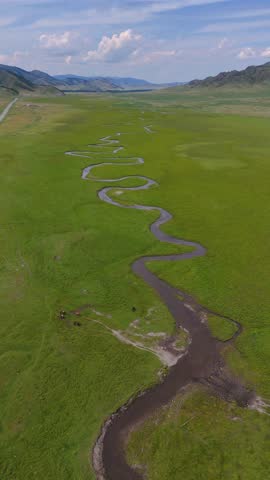 drone flight over a winding mountain river in autumn in Altai