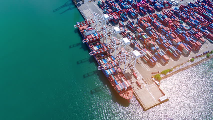 time lapse Cargo Container Ship at  international customs sea port. Crane loading cargo working at industry port. working freight shipping import export shipping concept.