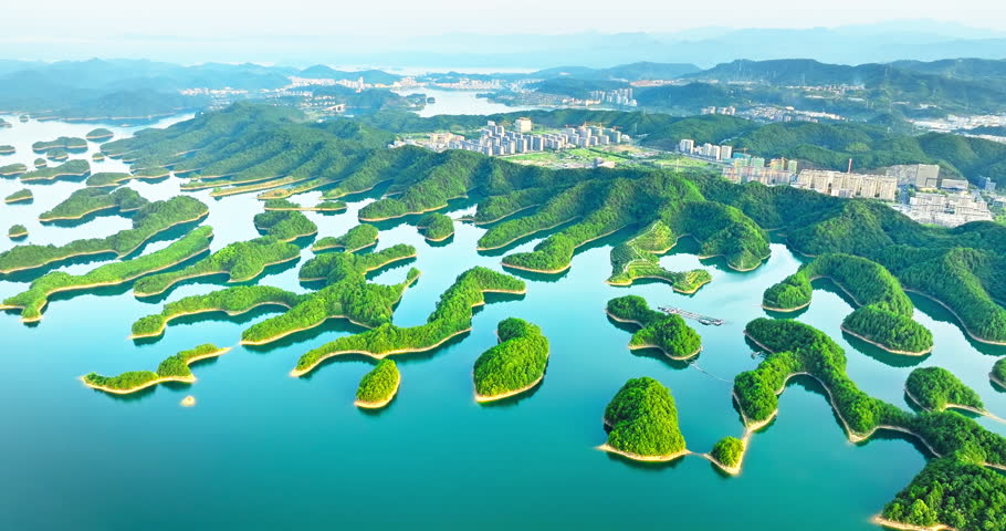 Aerial view of clear lake water and green islands natural landscape in Qiandao Lake, Hangzhou. Famous travel destination in China.