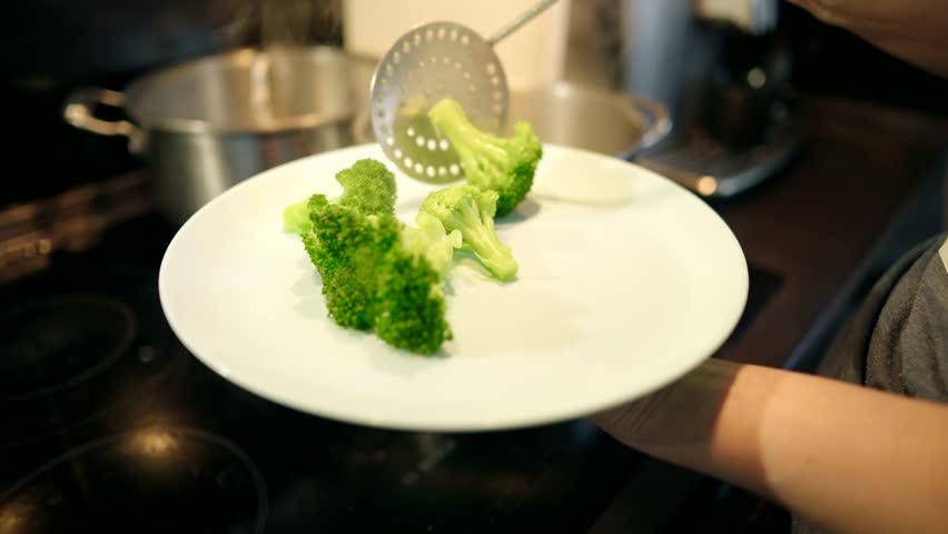 Diet And Vegetarianism For Loosing Weight And Keep Body Fit. Veggie Broccoli Cooking In Pan. Dieting Healthy Food. Vegetarian Diet On Slimming. Stir Fry Broccoli On Kitchen. Vegetable Salad On Diet 