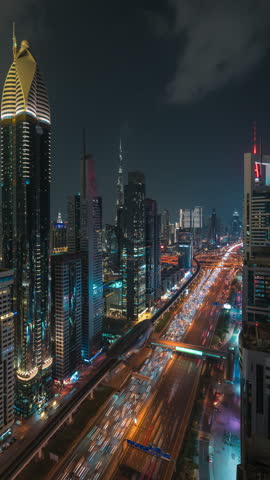 Timelapse view of traffic on Sheikh Zayed Road at night in Dubai, United Arab Emirates (UAE), zoom in. 