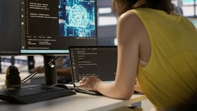 Hacker in office using laptop to steal company secrets, doing data breach, hiding from manager. Employee hired by competitor to spy, mining info from servers, closing notebook lid to hide, camera A - Powered by Shutterstock - Get 15% off with code: PIKWIZARD15