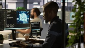 Admin creating AI machine learning models that can process and analyze data to improve decision making processes, looking at PC. Man programming in office using artificial intelligence tech, camera A - Powered by Shutterstock - Get 15% off with code: PIKWIZARD15