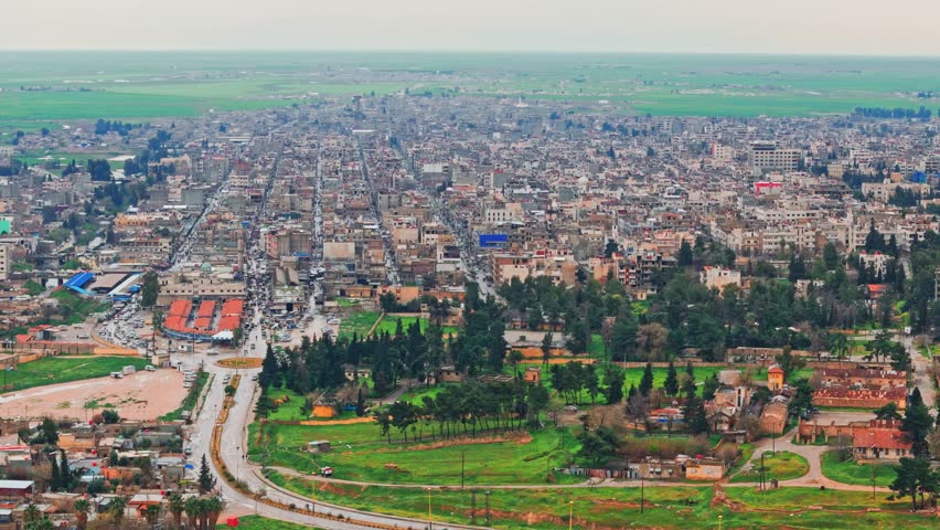 Aerial footage of Qamishli, Syria, showcasing houses, streets, and daily life. The city's architecture and flow of life offer viewers a glimpse into the current state of Qamishli.