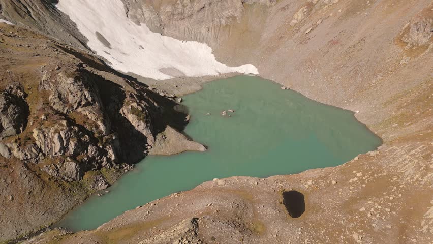 Aerial view Tsakatskarish lake. Samegrelo-Zemo Svaneti. Egrisi range. Caucasus mountains. Trekking destination in Georgia country. Hidden gem