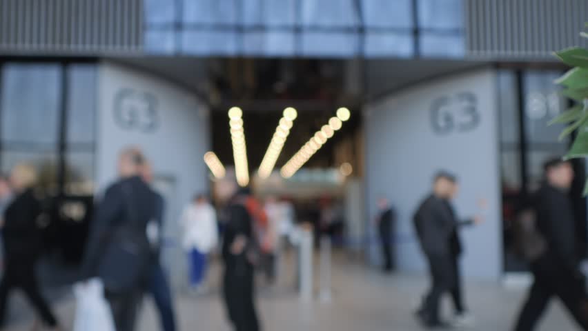 A busy and crowded entrance is seen at a vibrant urban venue filled with life and activity