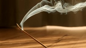 Burning aromatic incense smoky stick for meditation and relaxing. Aromatherapy smoke for yoga or SPA concept. - Powered by Shutterstock - Get 15% off with code: PIKWIZARD15