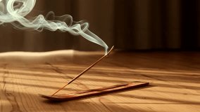 Burning aromatic incense smoky stick for meditation and relaxing. Aromatherapy smoke for yoga or SPA concept. - Powered by Shutterstock - Get 15% off with code: PIKWIZARD15