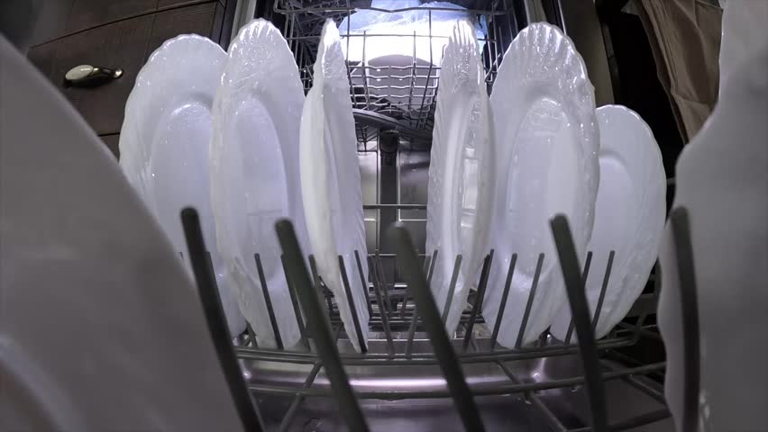 Water spraying on plates inside dishwasher