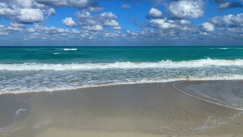 Clear Blue Sky and Calm Turquoise Waves on a Cuban Beach