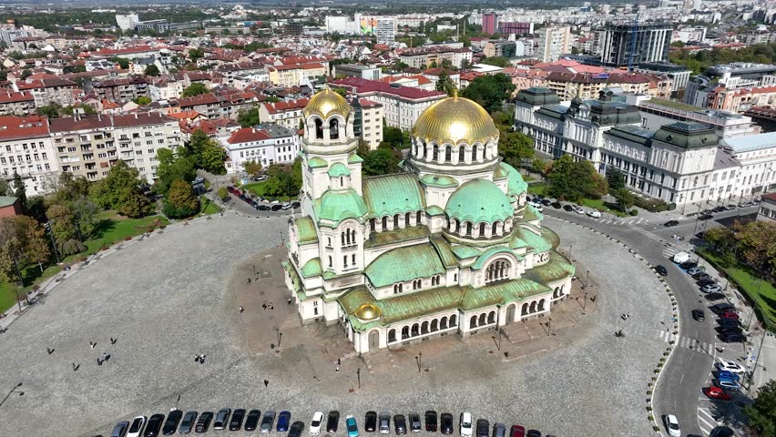 4K Aerial view of capital of Bulgaria, Sofia.Iconic building. View to cathedral St. Alexander Nevsky, the largest church in the Balkans. Lateral movement. Roofs of buildings, streets and park in Sofia