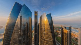 Aerial View of Etihad Towers in Abu Dhabi: The Iconic Skyscrapers Reflecting the Sunset Over the Cityscape. - Powered by Shutterstock - Get 15% off with code: PIKWIZARD15