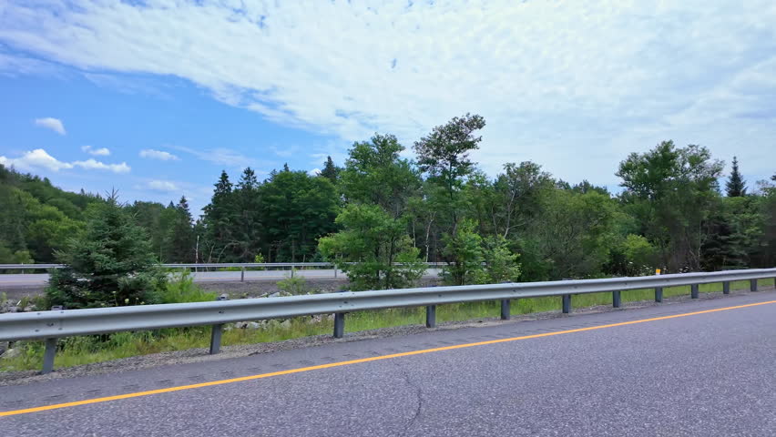 Empty highway 11 cloudy summer driving on the freeway to Toronto from Burk