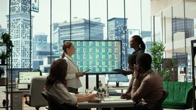 Management team holding a strategy session with the staff, focusing on digital marketing trends, budget allocation and progress tracking to achieve goals and boost market presence. Camera B. - Powered by Shutterstock - Get 15% off with code: PIKWIZARD15